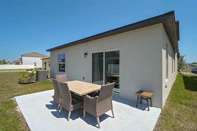 4523 Birdsong Dr, Palmetto, FL 34221 - view of patio featuring outdoor dining area and central AC unit