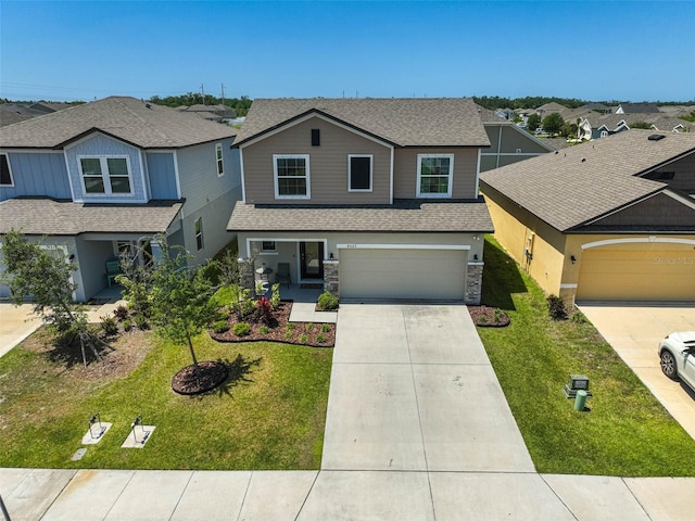 4523 Birdsong Dr, Palmetto, FL 34221 - view of front of house featuring driveway, stone siding, an attached garage, roof with shingles, and a residential view