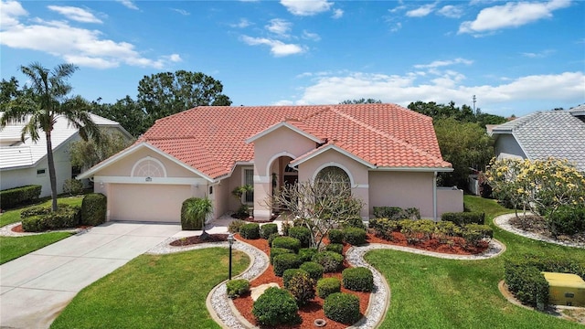 6507 Drewrys Blf, Bradenton, FL 34203 - mediterranean / spanish home with a garage, stucco siding, a front lawn, and concrete driveway