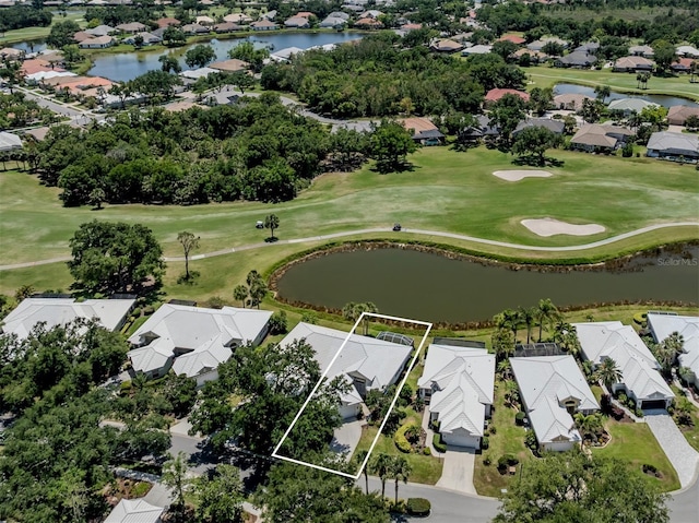 bird's eye view with a residential view and a water view
