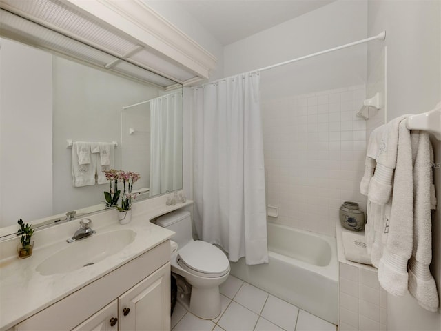 bathroom featuring vanity, toilet, tile patterned floors, and shower / tub combo