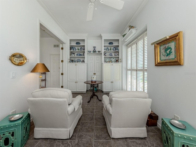 living room featuring crown molding, ceiling fan, built in features, dark tile patterned floors, and visible vents