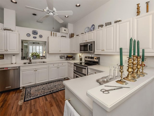 kitchen with a sink, light countertops, white cabinetry, a ceiling fan, and appliances with stainless steel finishes