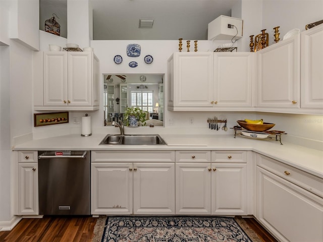 kitchen featuring white cabinets, visible vents, a sink, and dishwasher