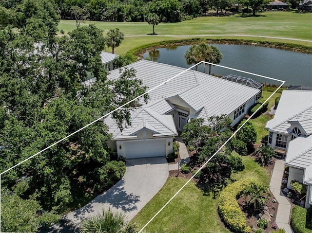 birds eye view of property with a water view and golf course view