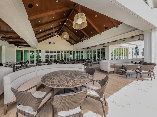 exterior space with outdoor dining area and ceiling fan