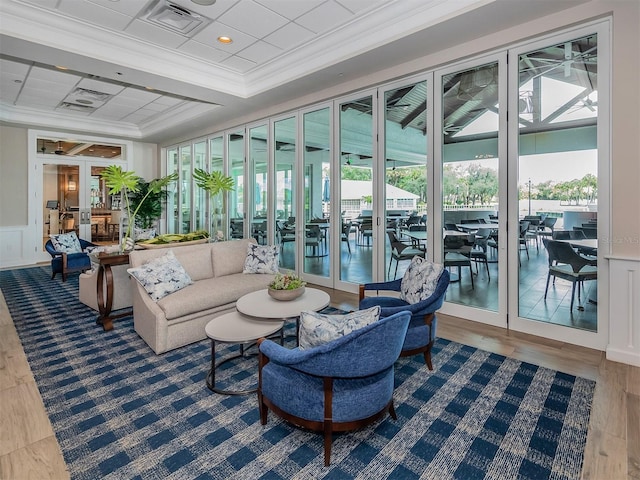sunroom featuring visible vents and french doors