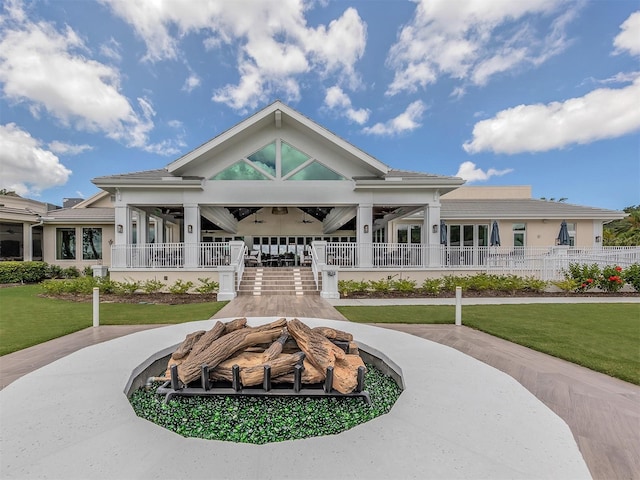surrounding community with fence and a yard