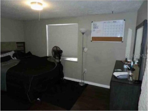 751 Arabian Cir, Nokomis, FL 34275 - bedroom featuring baseboards