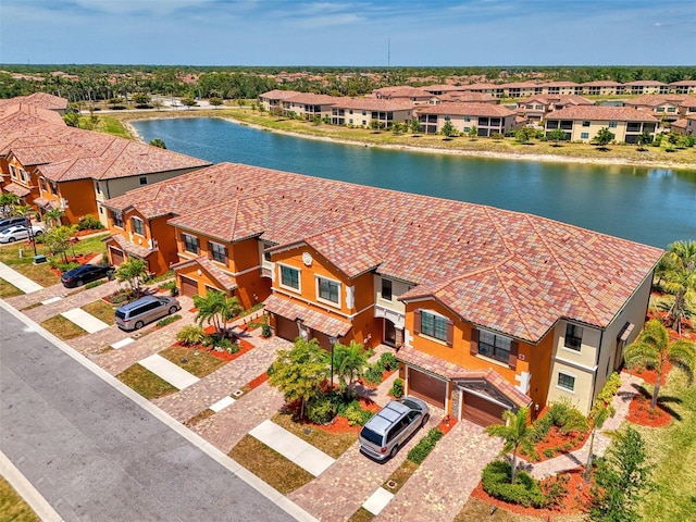bird's eye view featuring a residential view and a water view
