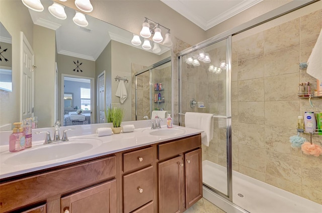 bathroom featuring connected bathroom, ornamental molding, a sink, and a stall shower