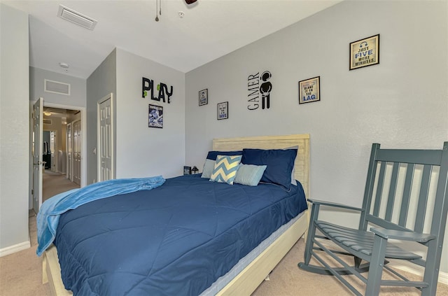 carpeted bedroom with baseboards, visible vents, and a closet