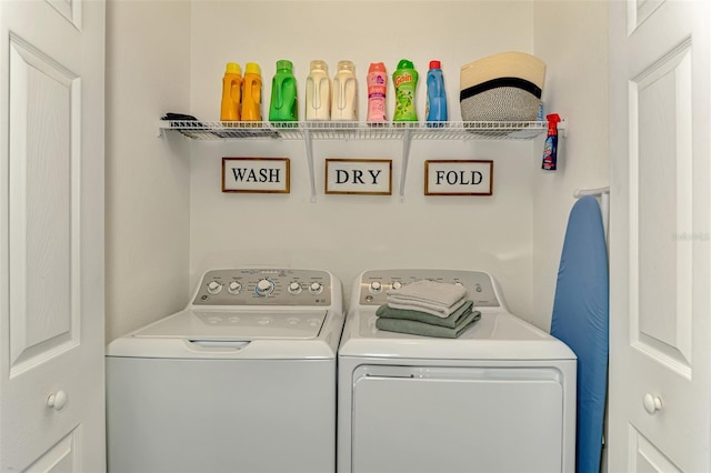 laundry room with laundry area and washer and clothes dryer