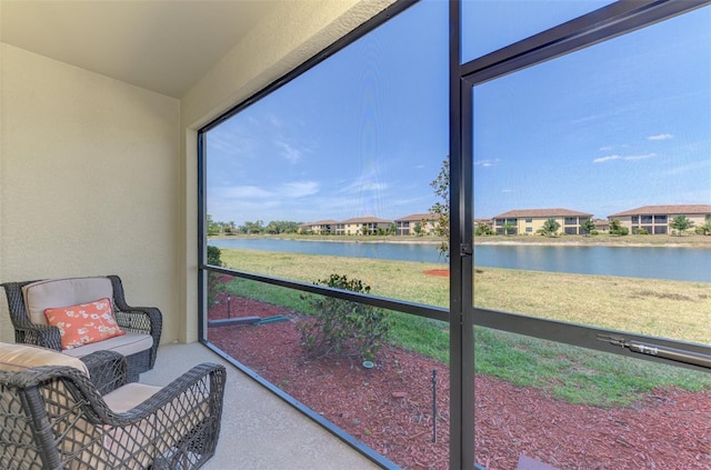 sunroom with a water view