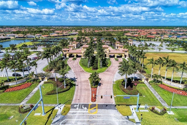 drone / aerial view with a water view and a residential view