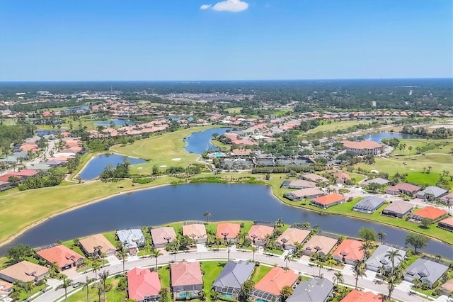bird's eye view featuring golf course view, a residential view, and a water view