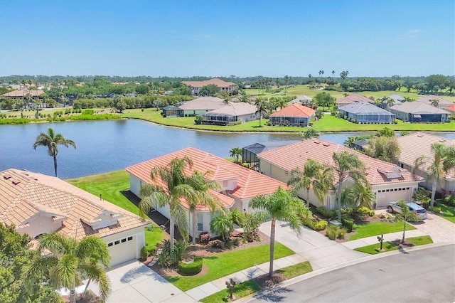 aerial view with a water view and a residential view