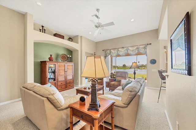 carpeted living area featuring recessed lighting, visible vents, a ceiling fan, and baseboards