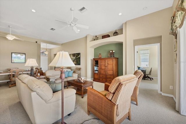 living area with recessed lighting, light carpet, baseboards, and ceiling fan