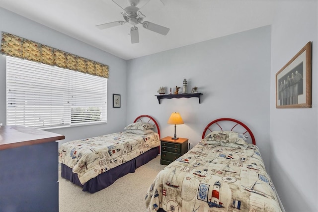 carpeted bedroom with a ceiling fan