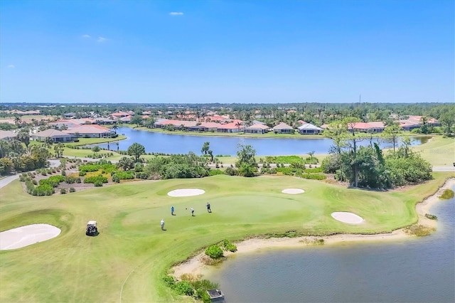 bird's eye view featuring a water view, a residential view, and view of golf course