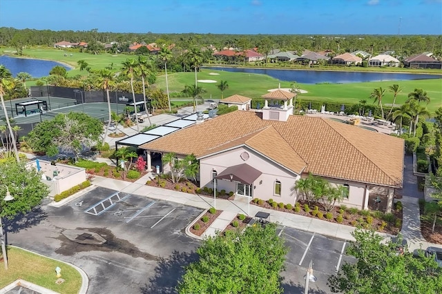 birds eye view of property featuring a residential view, view of golf course, and a water view