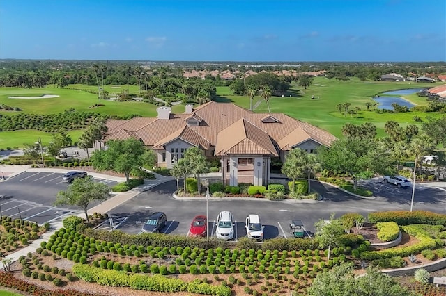 birds eye view of property featuring a water view and golf course view