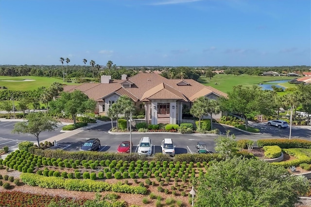 aerial view featuring view of golf course and a water view