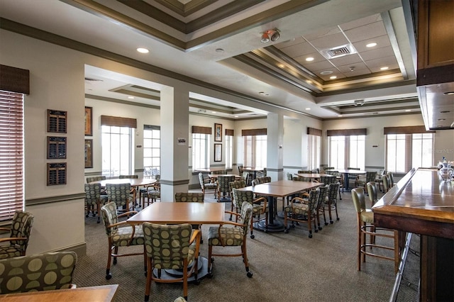 dining room with plenty of natural light, visible vents, and carpet
