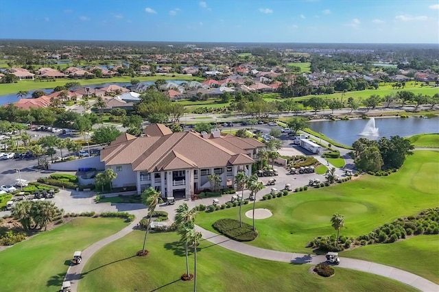 bird's eye view with a residential view, view of golf course, and a water view