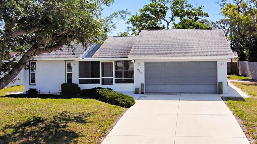 985 Everest Rd, Venice, FL 34293 - ranch-style home with stucco siding, fence, and a garage