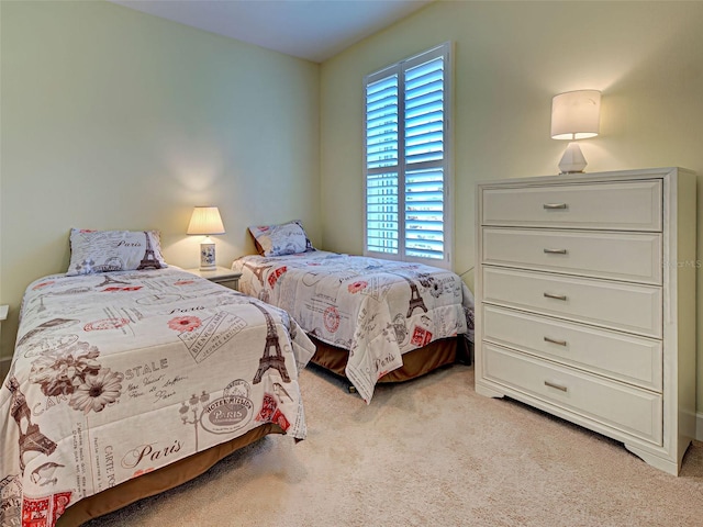 bedroom with light colored carpet