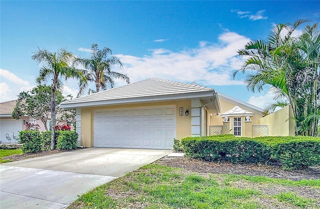 542 Clubside Cir Unit 20, Venice, FL 34293 - ranch-style house with a garage, stucco siding, and driveway