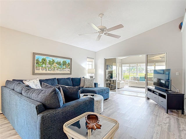 542 Clubside Cir Unit 20, Venice, FL 34293 - living room with ceiling fan, light wood-style flooring, and vaulted ceiling