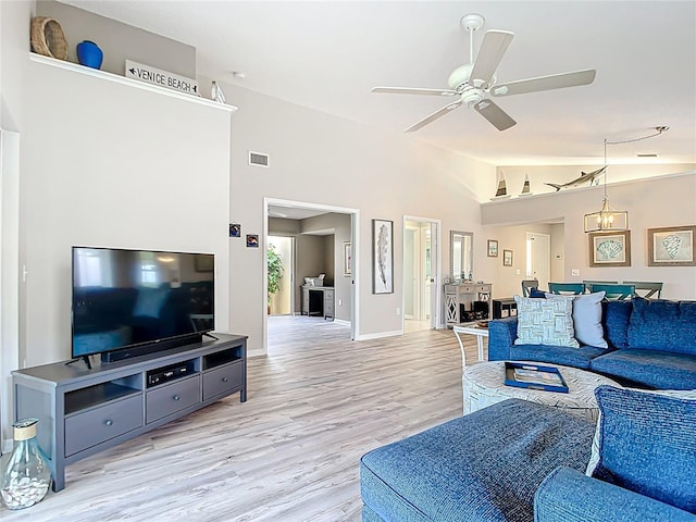 542 Clubside Cir Unit 20, Venice, FL 34293 - living area with light wood-type flooring, ceiling fan, baseboards, visible vents, and lofted ceiling