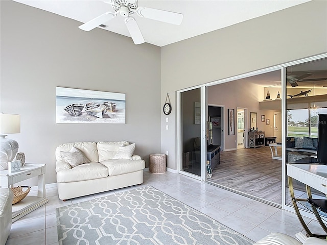542 Clubside Cir Unit 20, Venice, FL 34293 - tiled living room featuring ceiling fan and baseboards