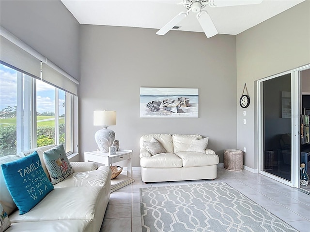 542 Clubside Cir Unit 20, Venice, FL 34293 - tiled living area with a ceiling fan and a towering ceiling
