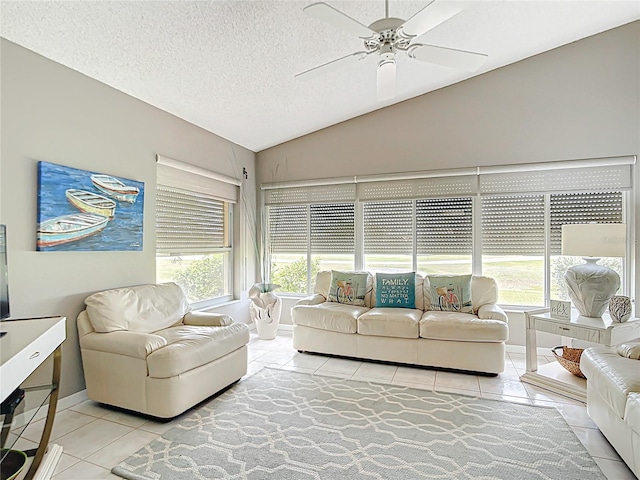 542 Clubside Cir Unit 20, Venice, FL 34293 - living room with light tile patterned flooring, ceiling fan, vaulted ceiling, and a textured ceiling