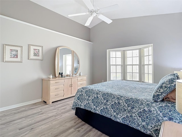 542 Clubside Cir Unit 20, Venice, FL 34293 - bedroom with a ceiling fan, high vaulted ceiling, light wood-style flooring, and baseboards