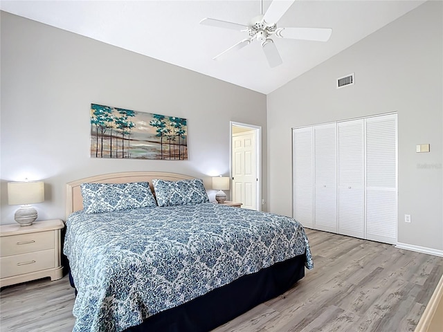 542 Clubside Cir Unit 20, Venice, FL 34293 - bedroom featuring visible vents, a closet, light wood-style flooring, and high vaulted ceiling