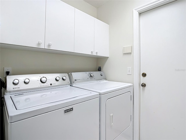 542 Clubside Cir Unit 20, Venice, FL 34293 - laundry room with cabinet space and washing machine and dryer