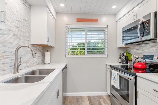 649 Tamiami Trl S Unit 106, Venice, FL 34285 - kitchen featuring recessed lighting, a sink, appliances with stainless steel finishes, and backsplash