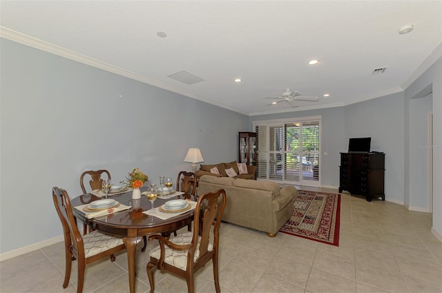 dining space with visible vents, ornamental molding, baseboards, and ceiling fan