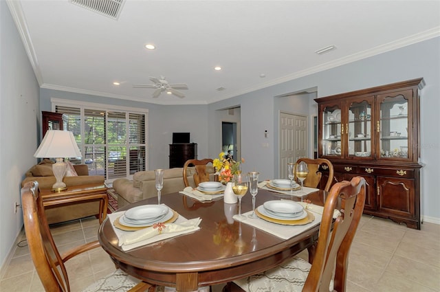dining room featuring baseboards, visible vents, and light tile patterned floors