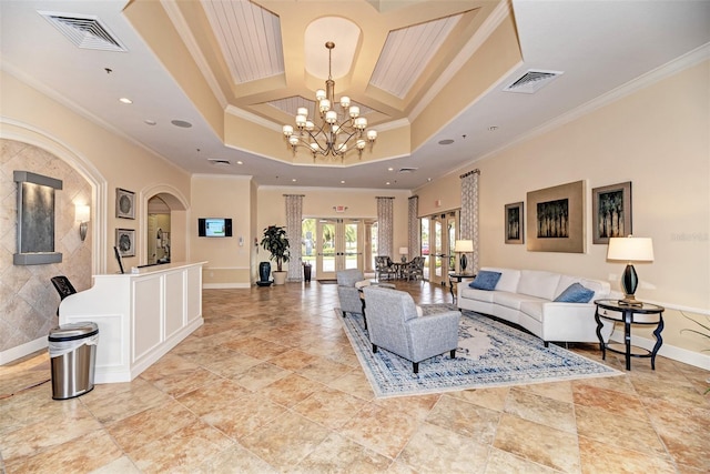 living room with ornamental molding, french doors, and visible vents