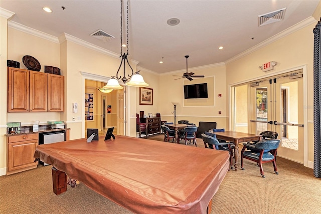 playroom featuring visible vents, ornamental molding, and light colored carpet