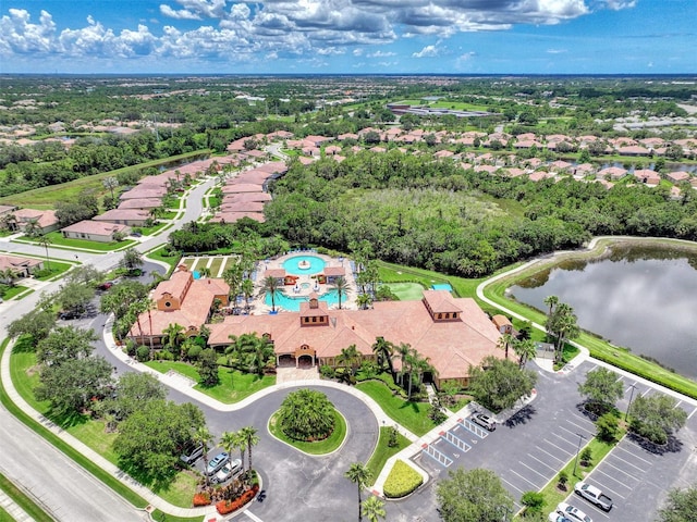 bird's eye view with a water view and a residential view