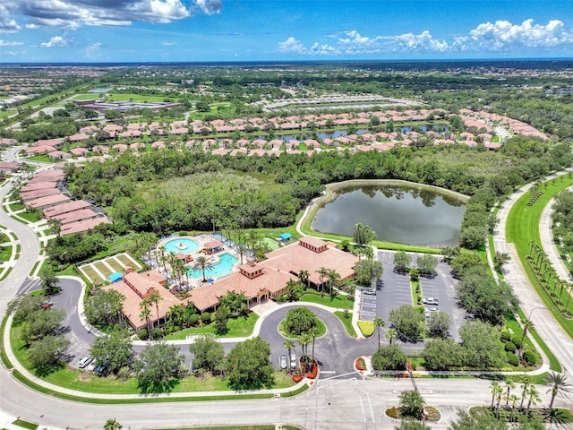 bird's eye view featuring a water view and a residential view