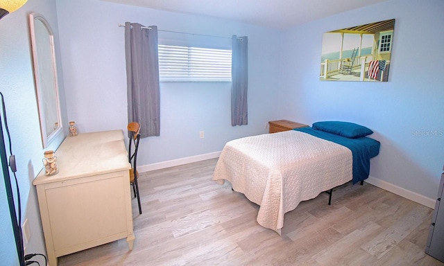 400 Base Unit 225, Venice, FL 34293 - bedroom with light wood-type flooring and baseboards