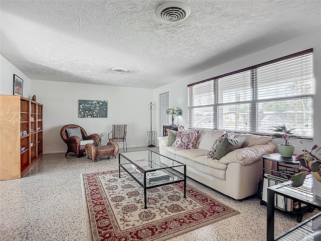 2108 Lee Ln, Sarasota, FL 34231 - living room featuring speckled floor and a textured ceiling